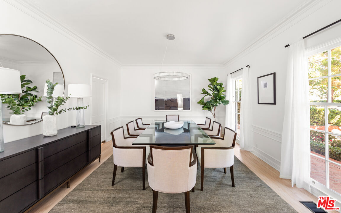 625 Sierra Drive Beverly Hills, CA 90210 - Photo 6 of 25 a view of a dining room with furniture and window