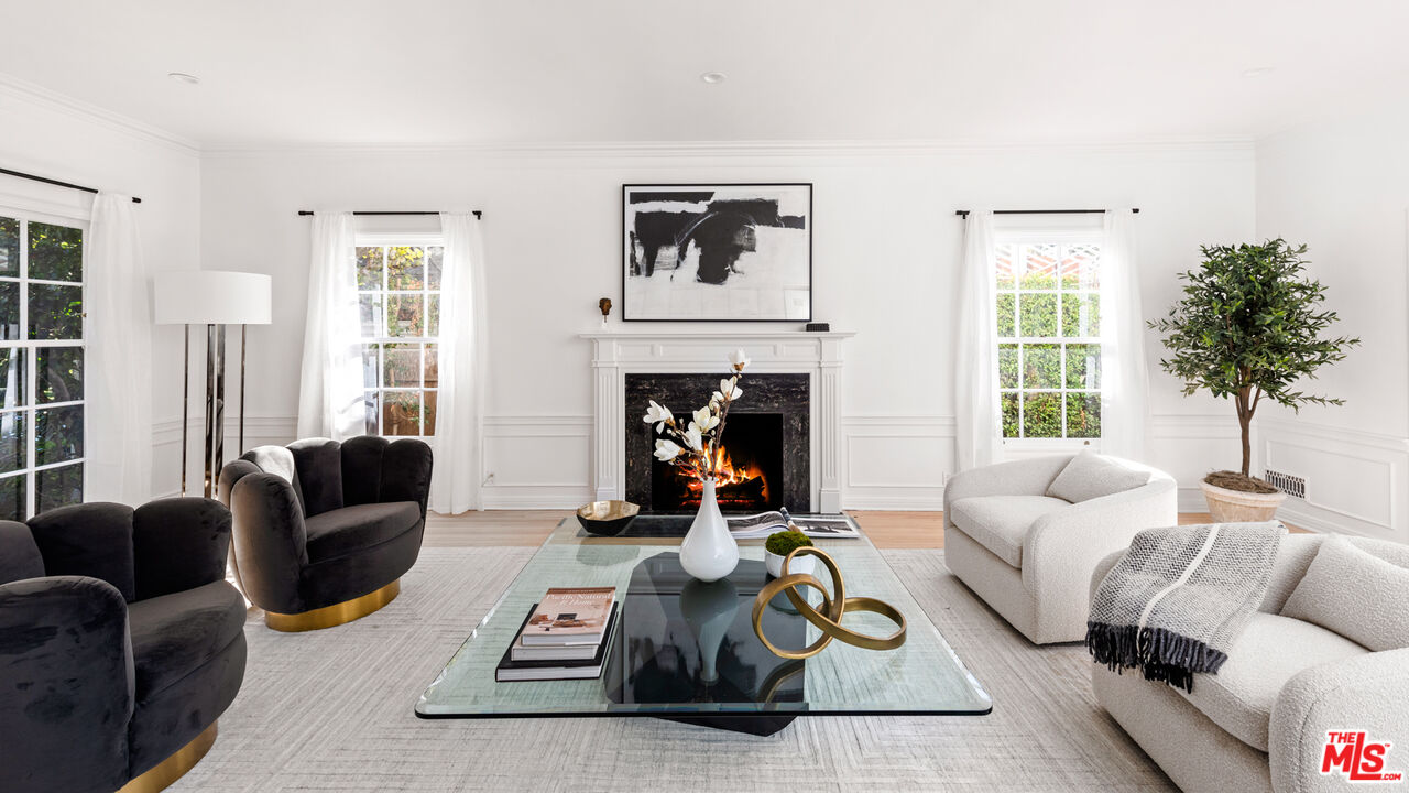 625 Sierra Drive Beverly Hills, CA 90210 - Photo 8 of 25 a living room with furniture and a fireplace