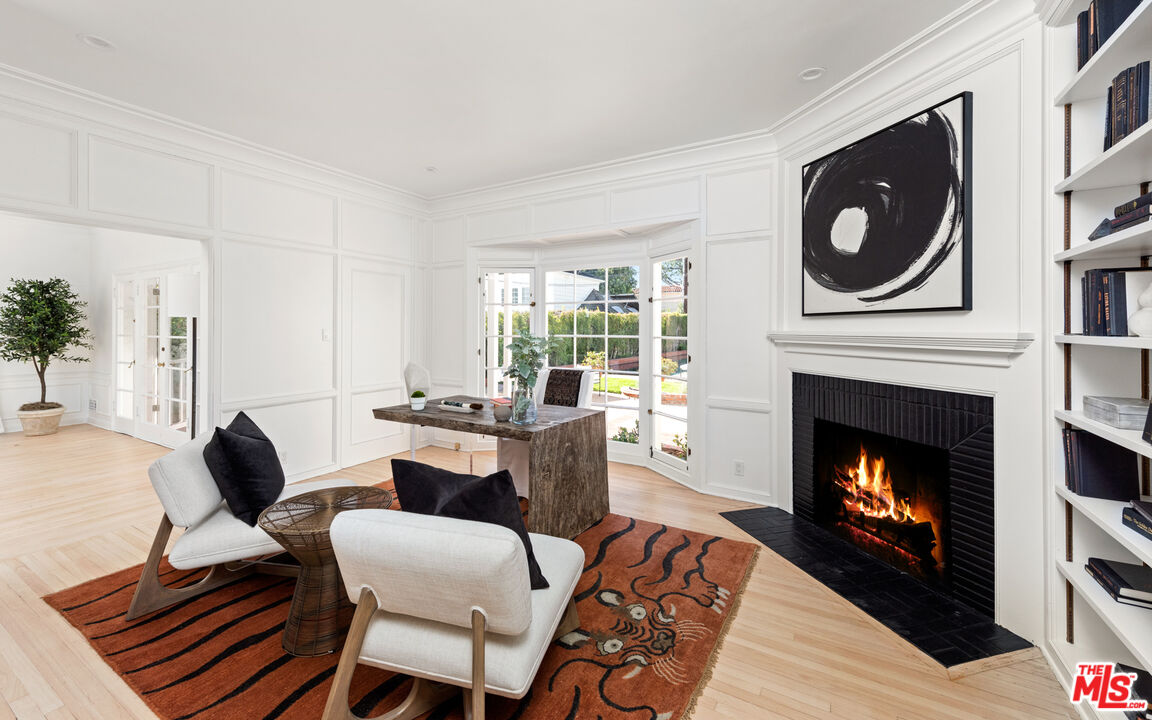 625 Sierra Drive Beverly Hills, CA 90210 - Photo 9 of 25 a living room with furniture and a fireplace
