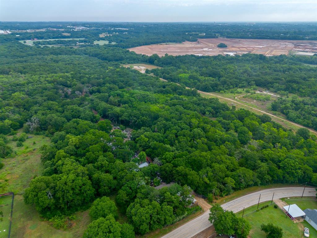 8635 Retta Mansfield Road Mansfield, TX 76063 - Photo 6 of 11 an aerial view of residential houses with outdoor space and trees