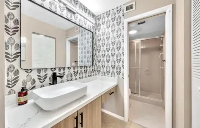 a bathroom with a sink and a mirror