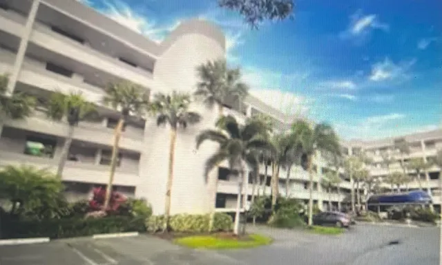 a city street lined with buildings and trees