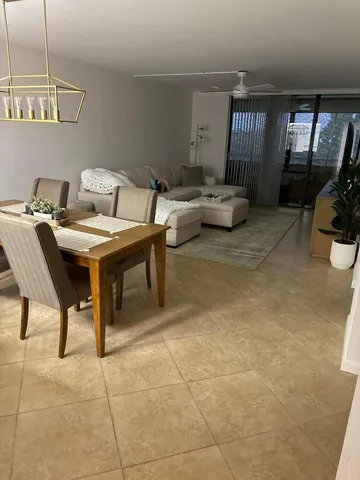 a living room with furniture a couch and a flat screen tv