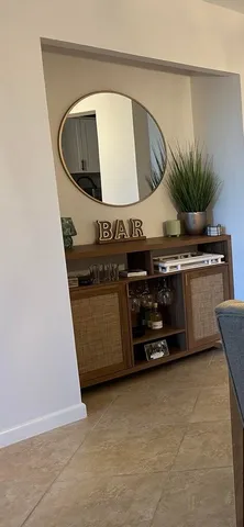 a kitchen with a stove and a mirror