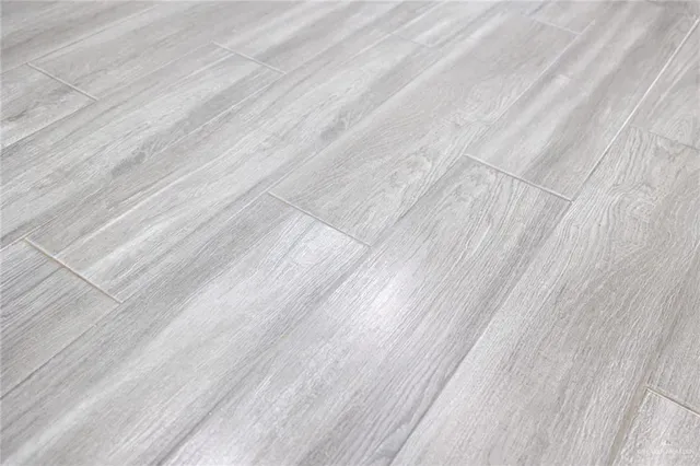 a bathroom with a shower and a window