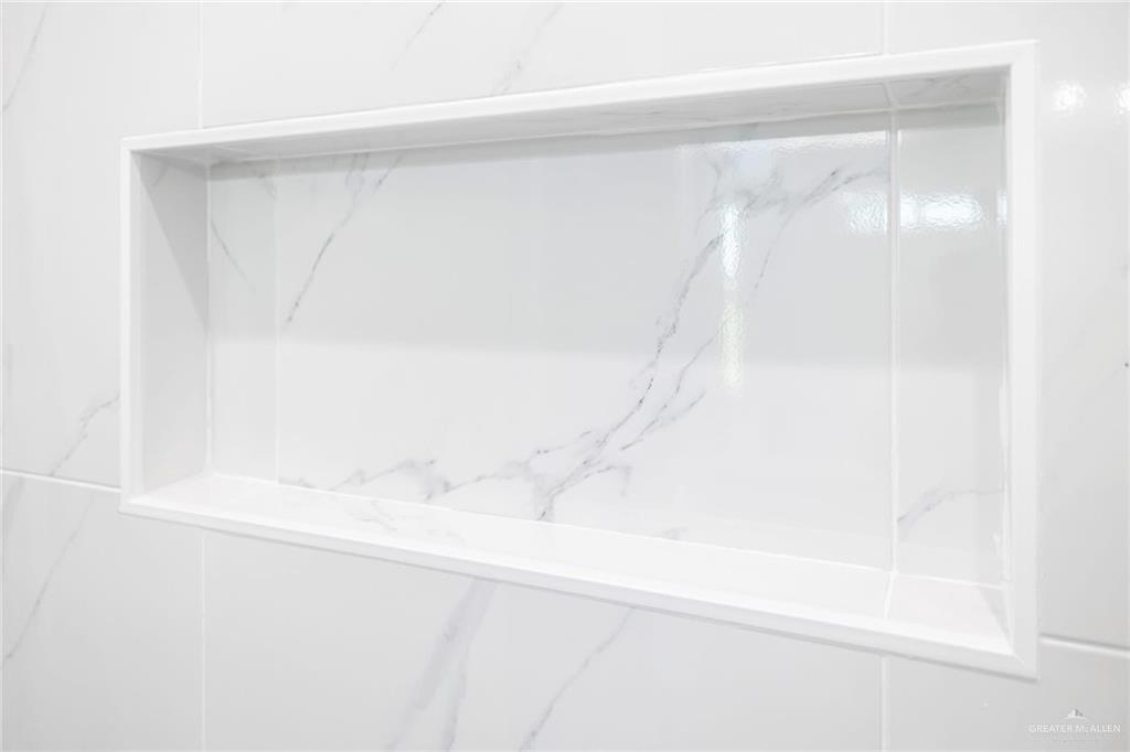 7710 Navel Lane Mission, TX 78574 - Photo 20 of 20 a bathroom with a shower and a window