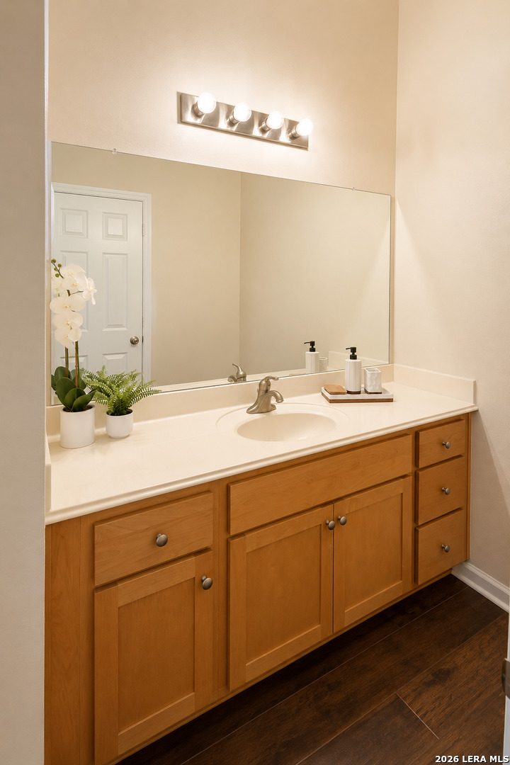 6160 Eckhert Road, Unit 804 San Antonio, TX 78240 - Photo 23 of 38 a bathroom with a double vanity sink and mirror