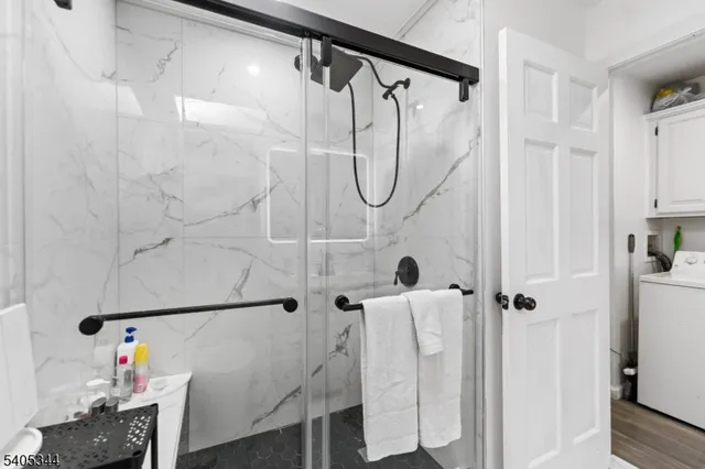 a bathroom with a shower and a shower