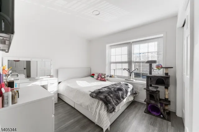 a bedroom with a bed and a table in it