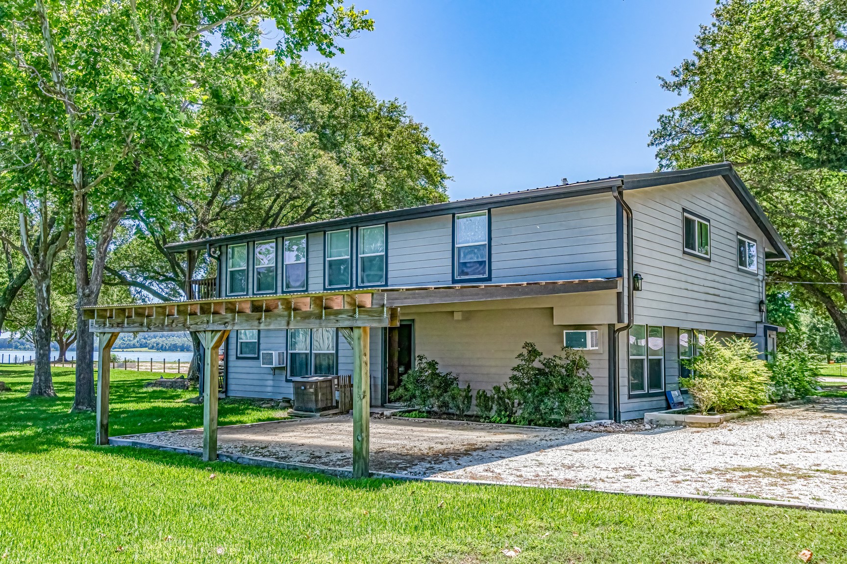 480 Johnson Road Coldspring, TX 77331 - Photo 14 of 49 2-car attached carport that walks in directly to the lower level