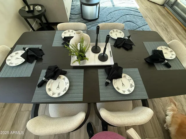 a kitchen with a table and a chair