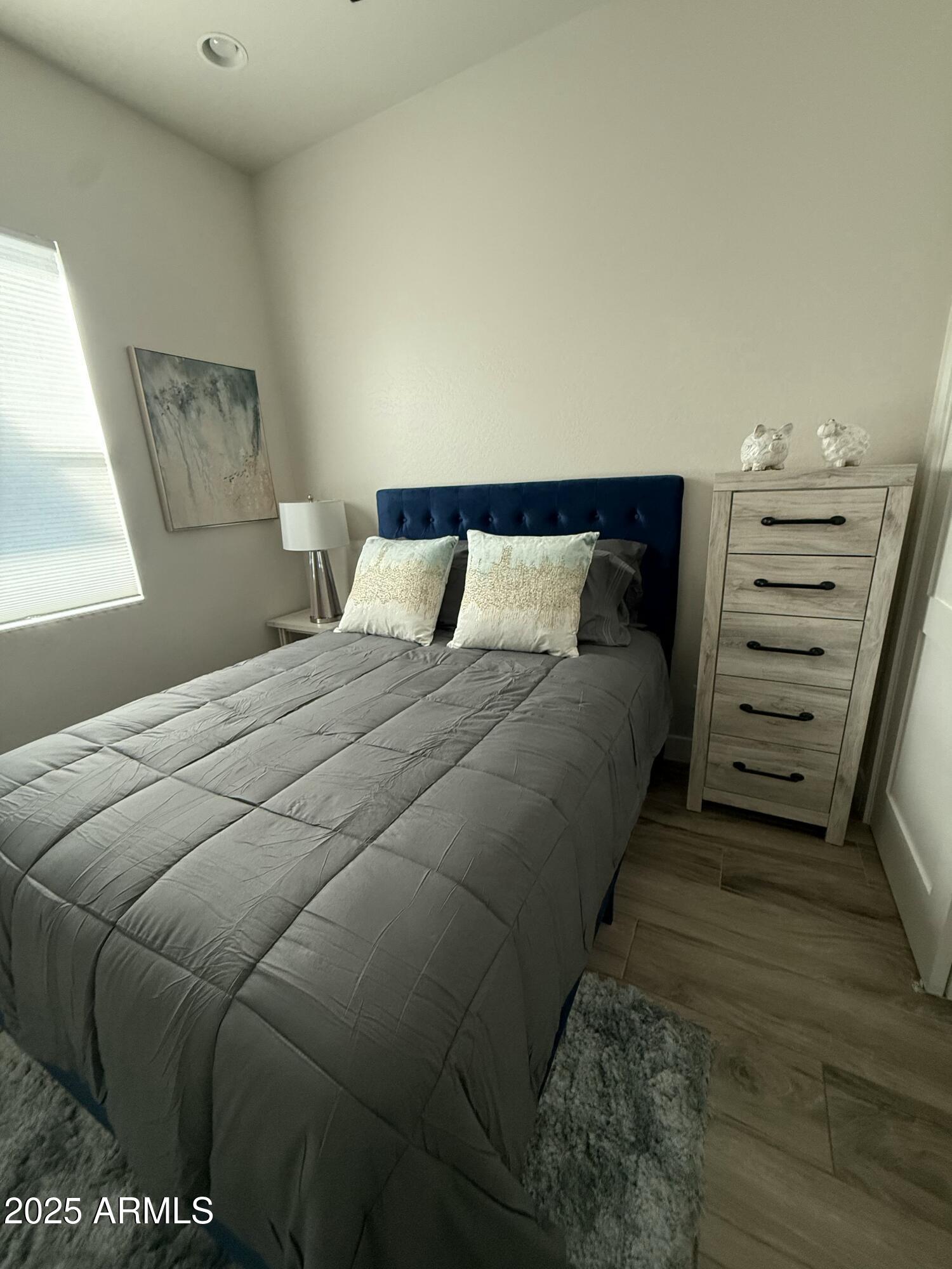 2007 East Rainbow Trail Payson, AZ 85541 - Photo 17 of 27 a bedroom with a bed and a lamp