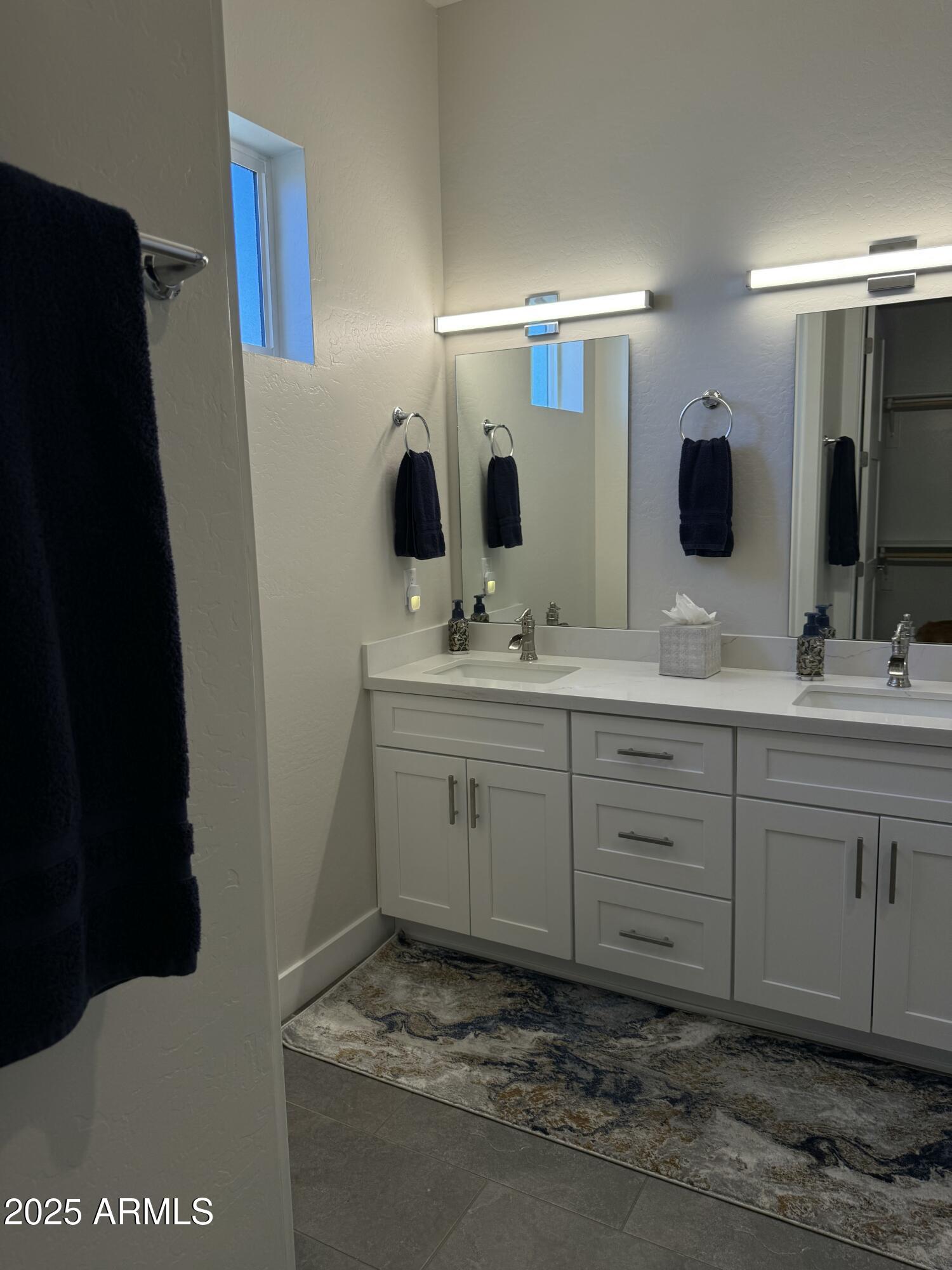 2007 East Rainbow Trail Payson, AZ 85541 - Photo 22 of 27 a bathroom with a double vanity sink and mirror
