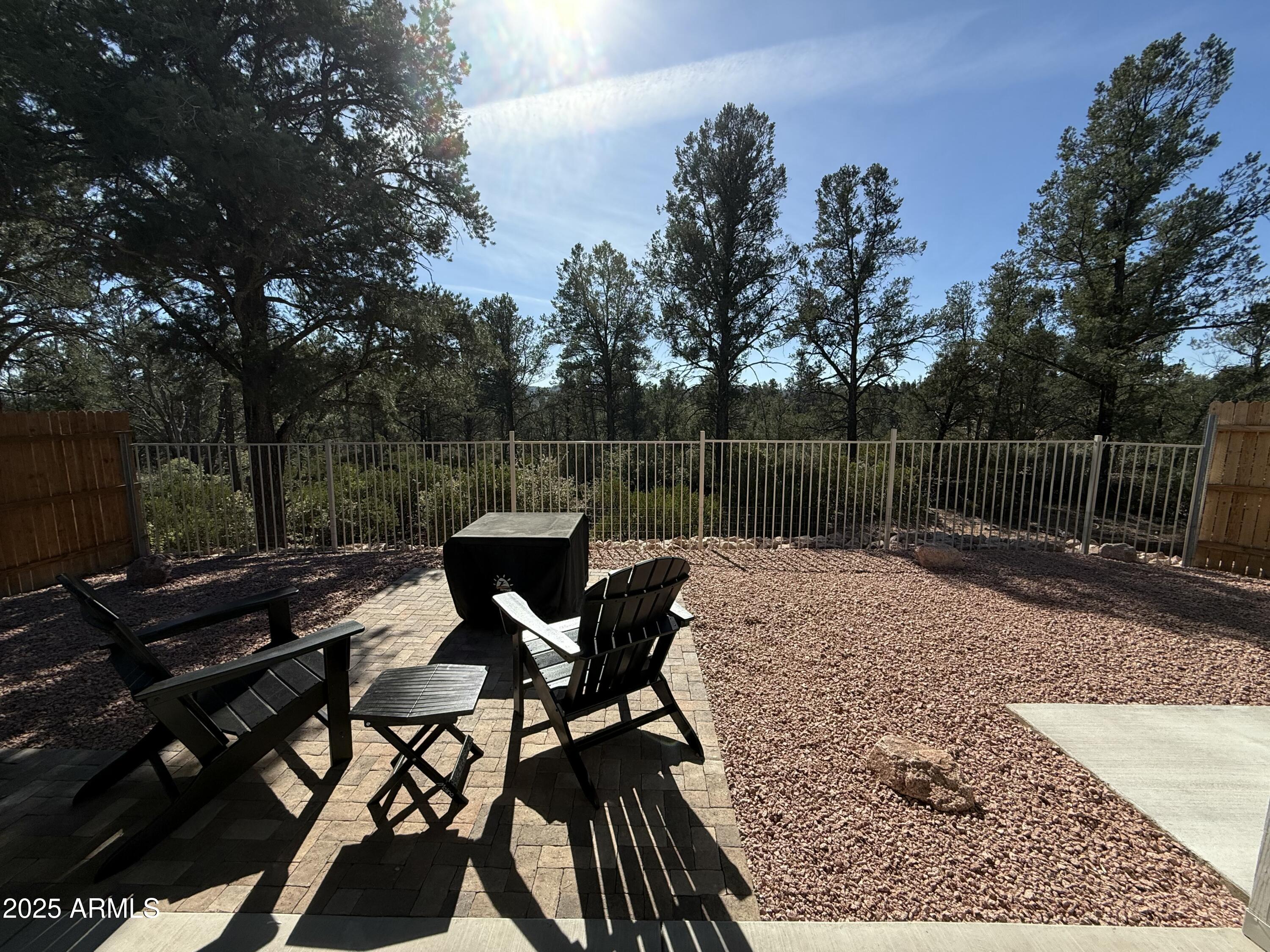 2007 East Rainbow Trail Payson, AZ 85541 - Photo 24 of 27 a view of a roof deck with table and chairs and wooden floor
