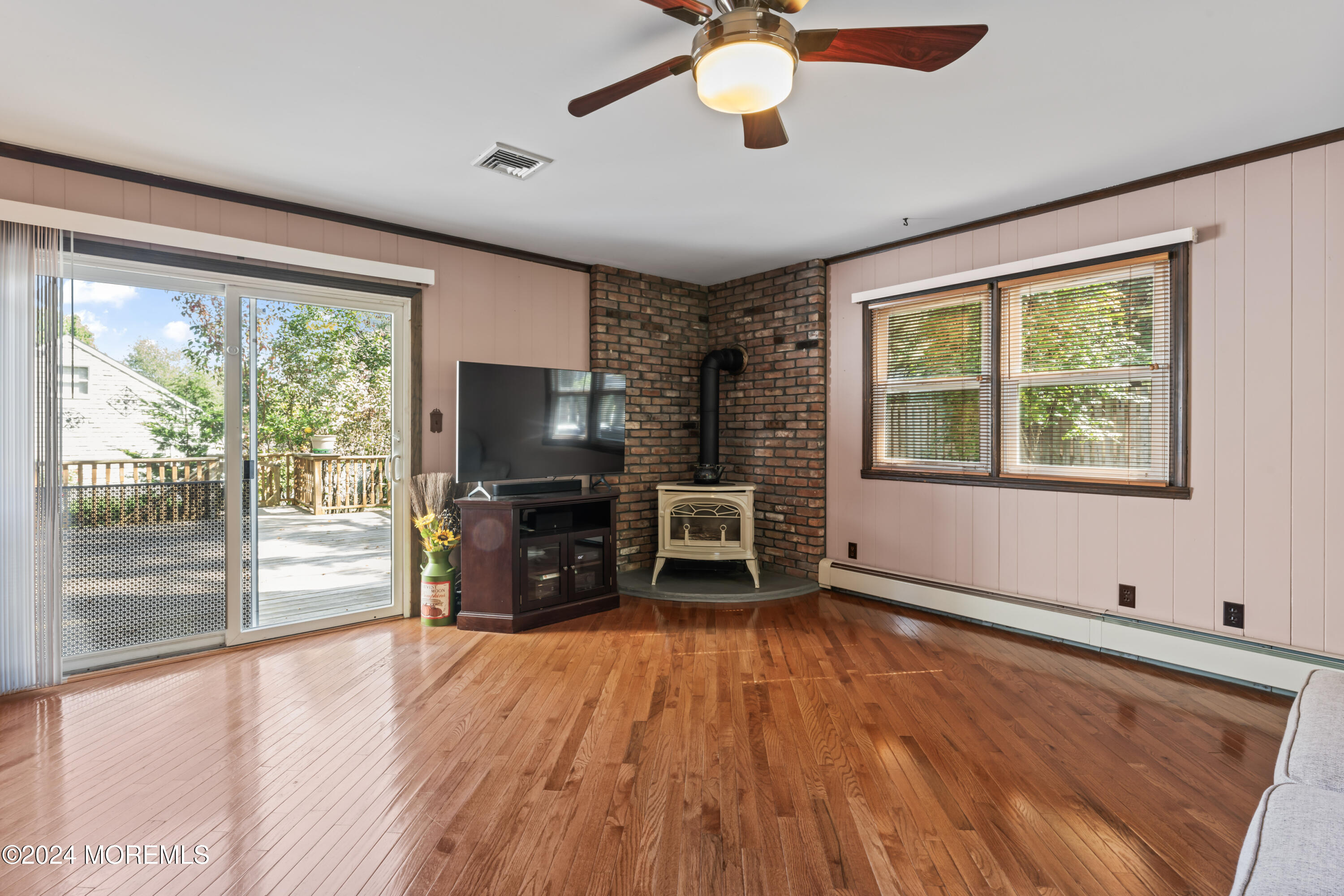 55 Swimming River Road Lincroft, NJ 07738 - Photo 15 of 51 a living room with furniture and a flat screen tv