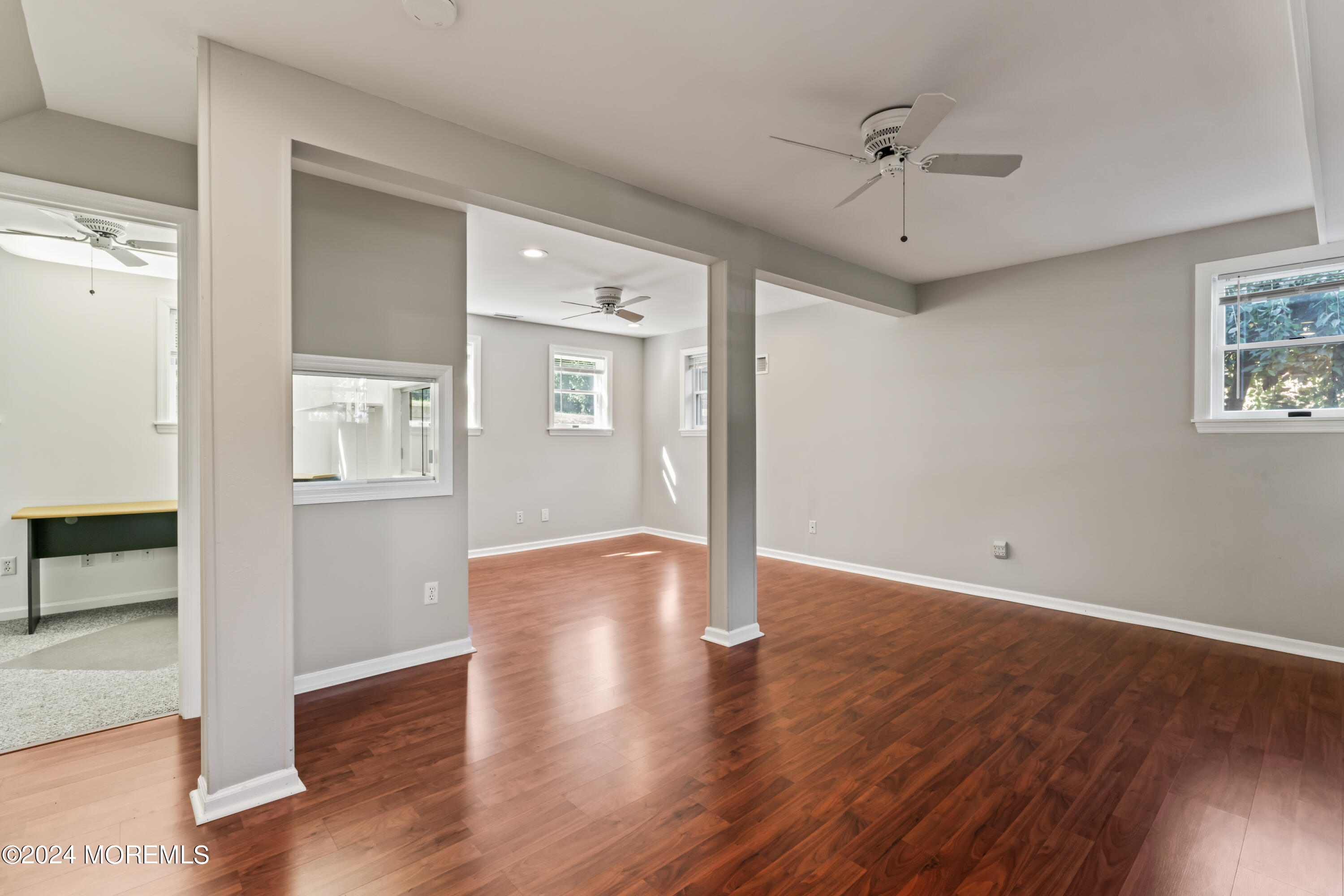 55 Swimming River Road Lincroft, NJ 07738 - Photo 34 of 51 a view of an empty room with wooden floor
