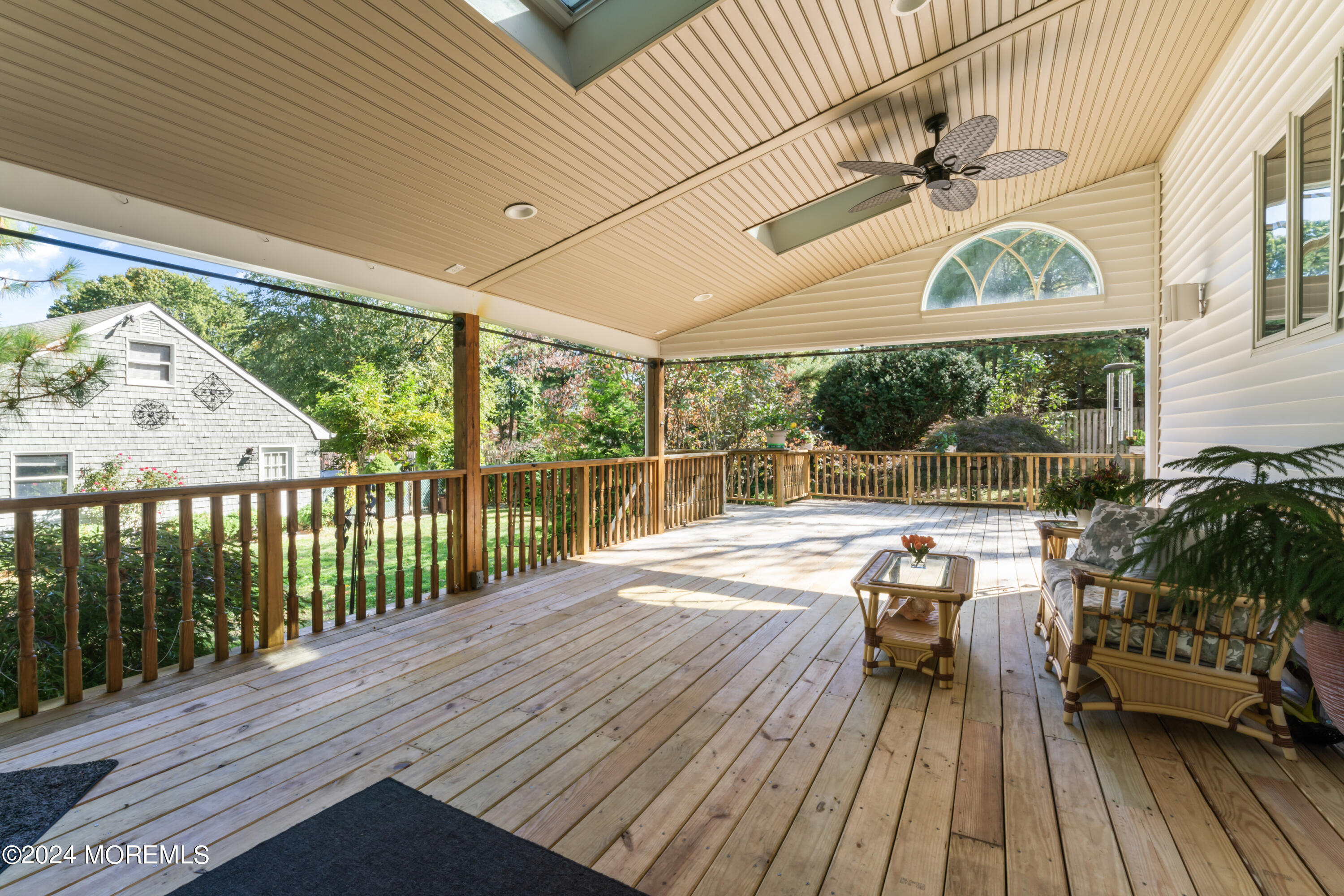 55 Swimming River Road Lincroft, NJ 07738 - Photo 40 of 51 a view of balcony with furniture and wooden floor
