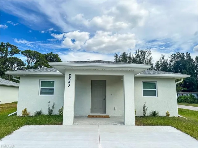 front view of a house with a yard