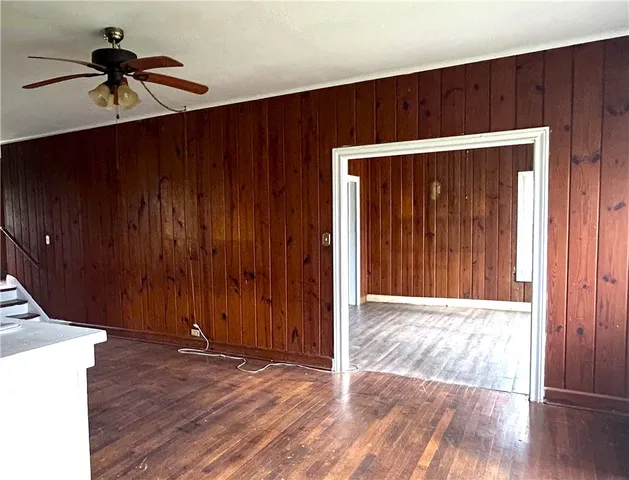 a view of an entryway with wooden floor