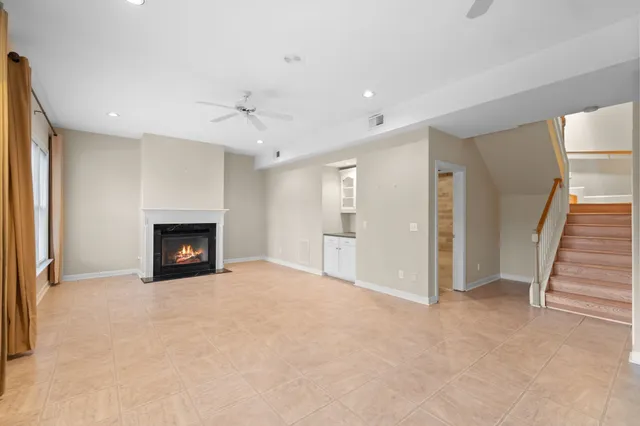 a view of an empty room with a fireplace