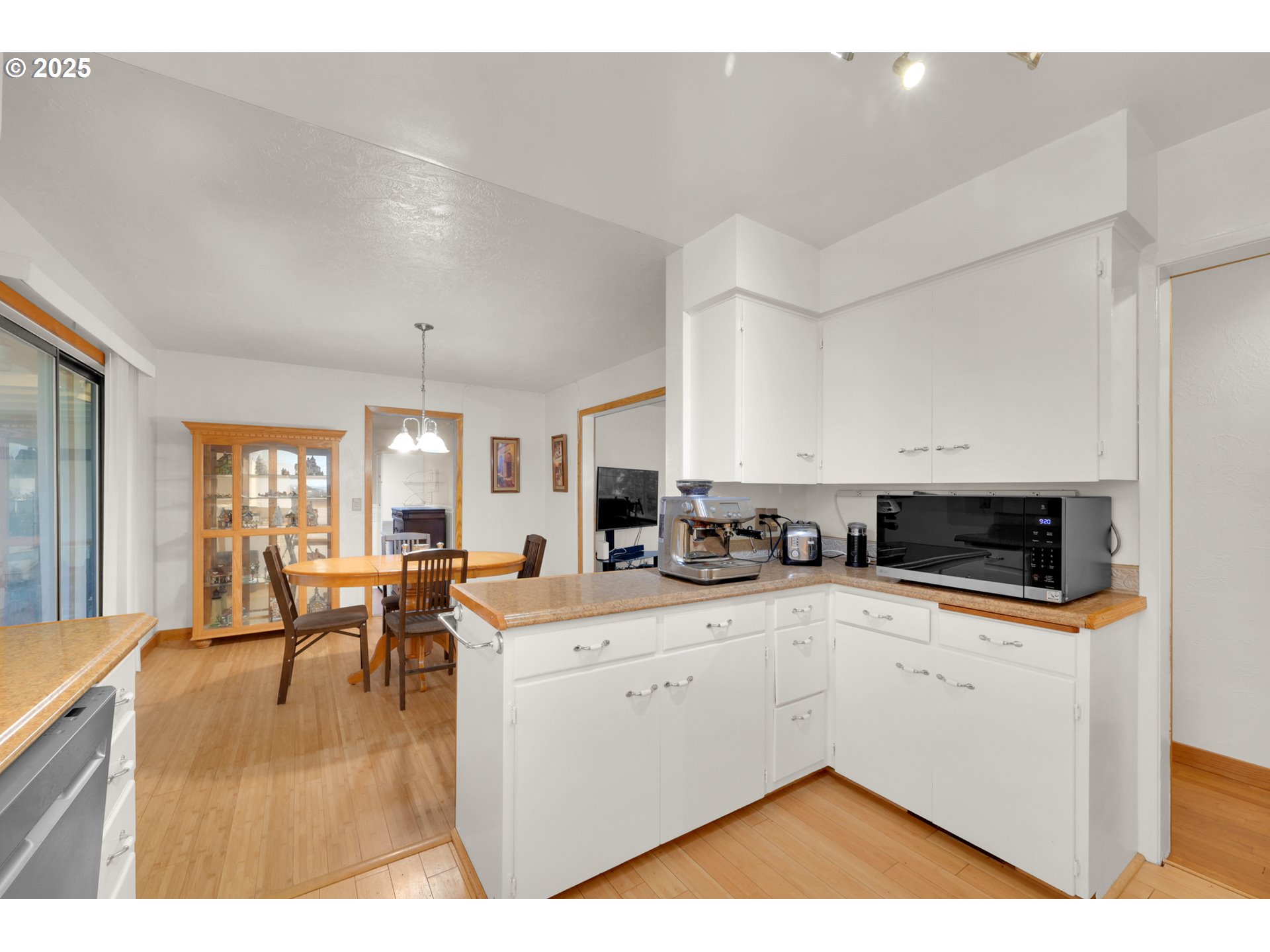 2617 Southeast Fulton Street Albany, OR 97322 - Photo 12 of 35 a kitchen with a sink stove and cabinets