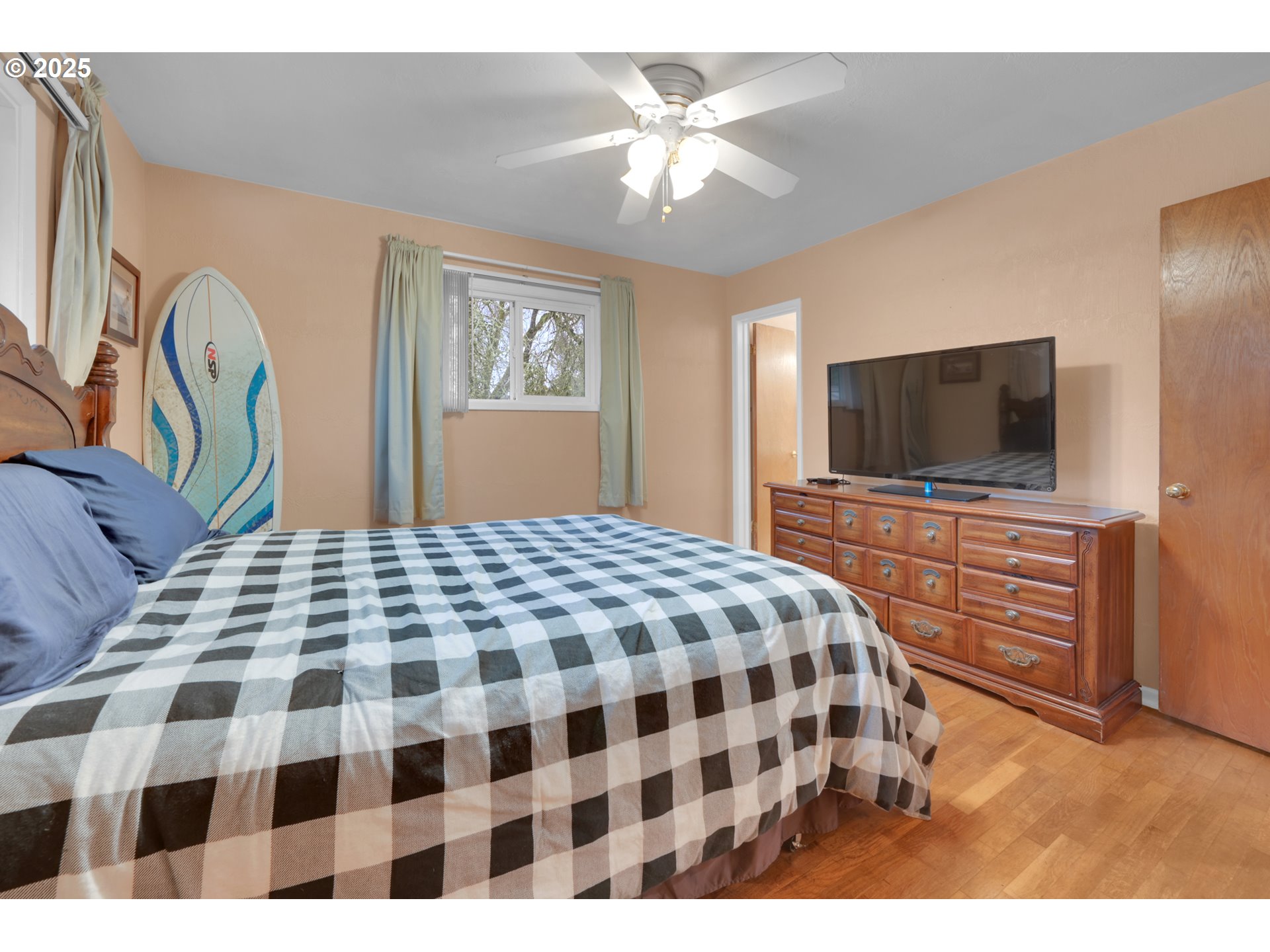 2617 Southeast Fulton Street Albany, OR 97322 - Photo 15 of 35 a bedroom with a bed and a flat screen tv