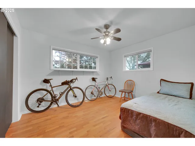a bedroom with furniture and a window