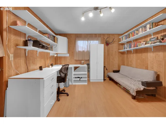 a living room with a couch and a table with wooden floor