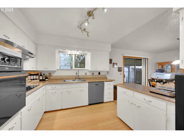 a kitchen with a sink and cabinets