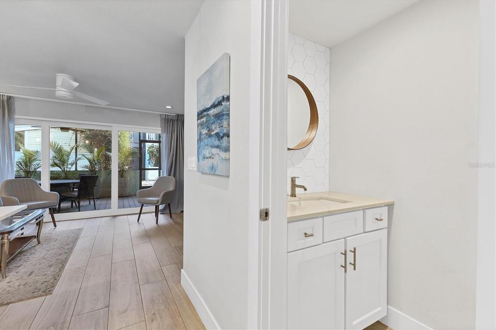 1762 Stickney Point Road, Unit 204 Sarasota, FL 34231 - Photo 17 of 38 a very nice looking room with wooden floor