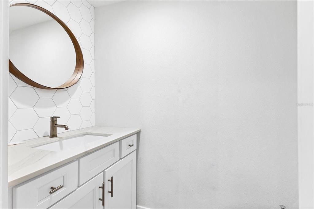 1762 Stickney Point Road, Unit 204 Sarasota, FL 34231 - Photo 18 of 38 a bathroom with a sink and a mirror