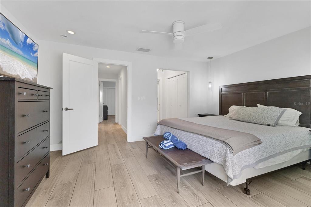 1762 Stickney Point Road, Unit 204 Sarasota, FL 34231 - Photo 21 of 38 a bedroom with a bed and cabinet