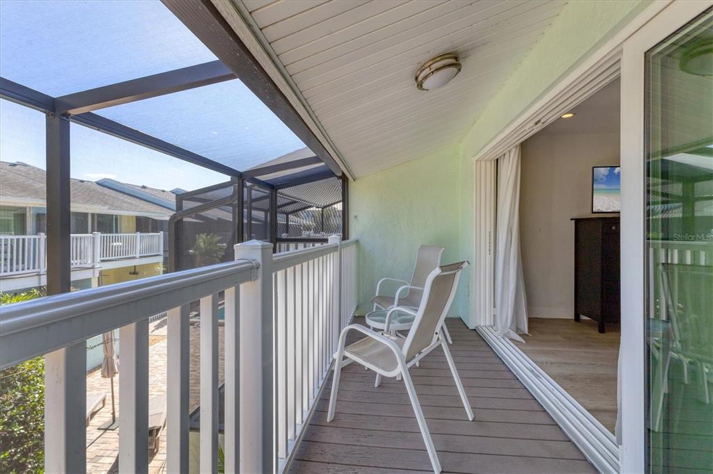 1762 Stickney Point Road, Unit 204 Sarasota, FL 34231 - Photo 23 of 38 a view of a two chairs in the balcony