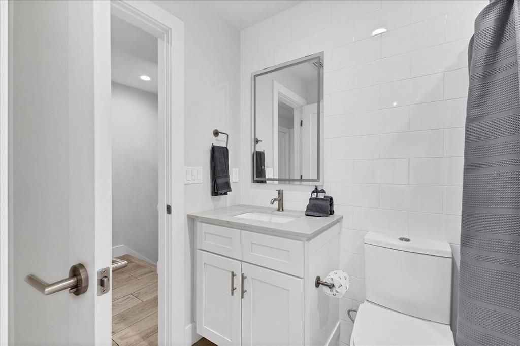 1762 Stickney Point Road, Unit 204 Sarasota, FL 34231 - Photo 25 of 38 a bathroom with a sink and mirror