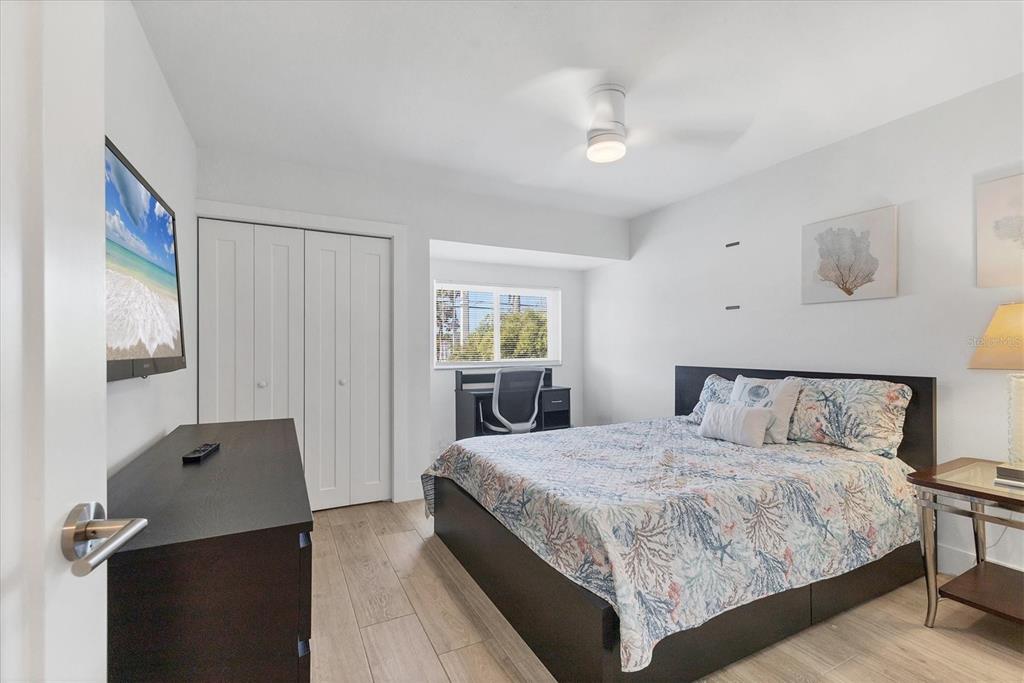 1762 Stickney Point Road, Unit 204 Sarasota, FL 34231 - Photo 26 of 38 a bedroom with a bed and window