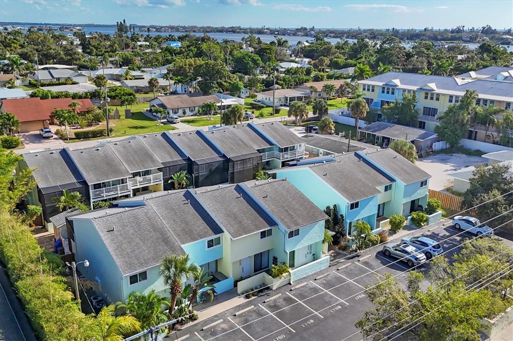 1762 Stickney Point Road, Unit 204 Sarasota, FL 34231 - Photo 3 of 38 an aerial view of multiple house