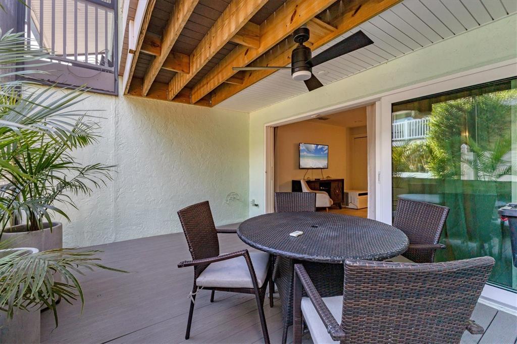 1762 Stickney Point Road, Unit 204 Sarasota, FL 34231 - Photo 31 of 38 a view of a patio filled with furniture