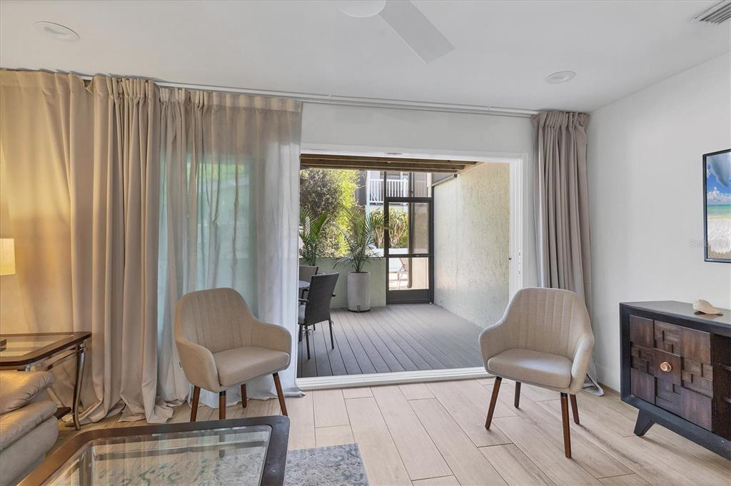 1762 Stickney Point Road, Unit 204 Sarasota, FL 34231 - Photo 8 of 38 a living room with furniture and a window