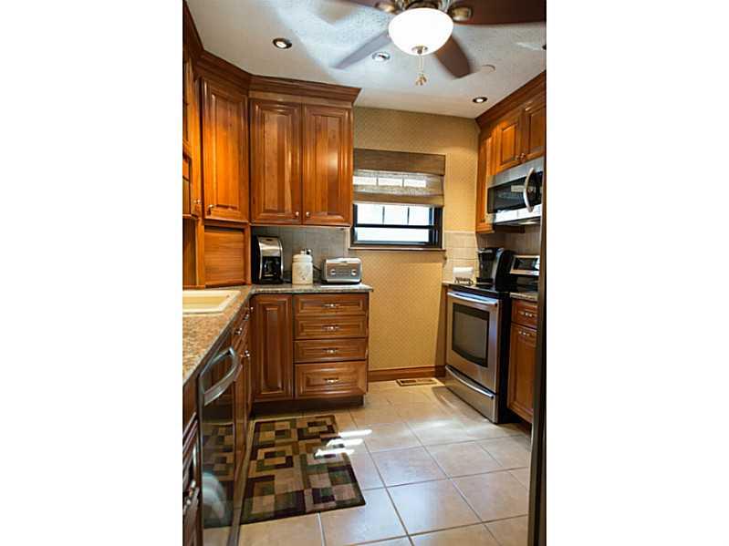 4773 Bayfield Road Allison Park, PA 15101 - Photo 5 of 22 Kitchen. Cherry cabinetry, granite counter tops, ceramic tile floor & back splash and stainless steel appliances.