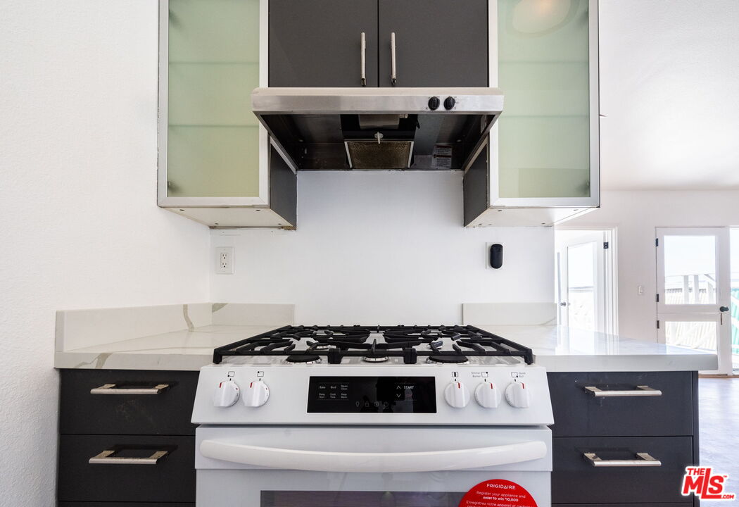 20644 Pacific Coast Highway Malibu, CA 90265 - Photo 18 of 32 a stove top oven sitting inside of a kitchen