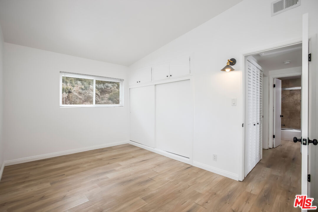 20644 Pacific Coast Highway Malibu, CA 90265 - Photo 24 of 32 a view of a room with wooden floor and a hallway