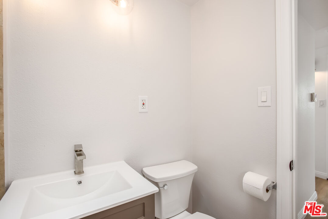 20644 Pacific Coast Highway Malibu, CA 90265 - Photo 29 of 32 a bathroom with a sink a toilet and mirror