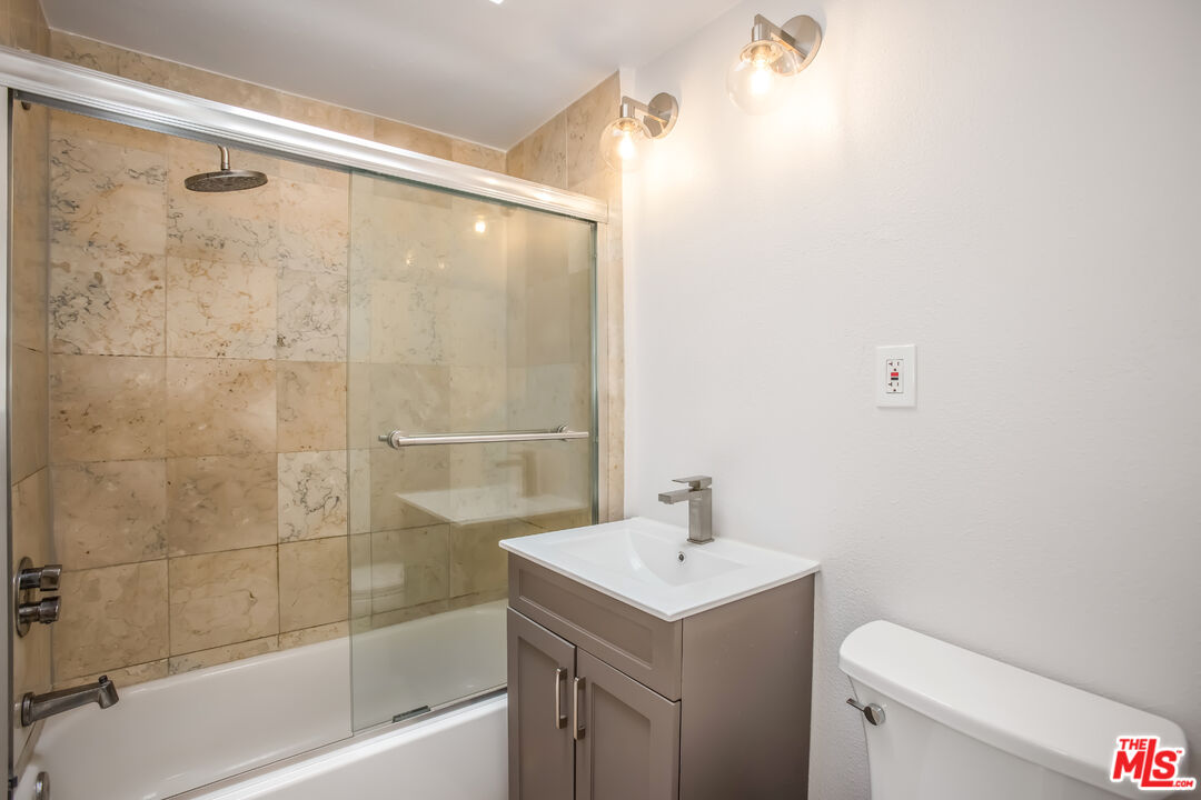 20644 Pacific Coast Highway Malibu, CA 90265 - Photo 30 of 32 a bathroom with a shower a sink and a toilet