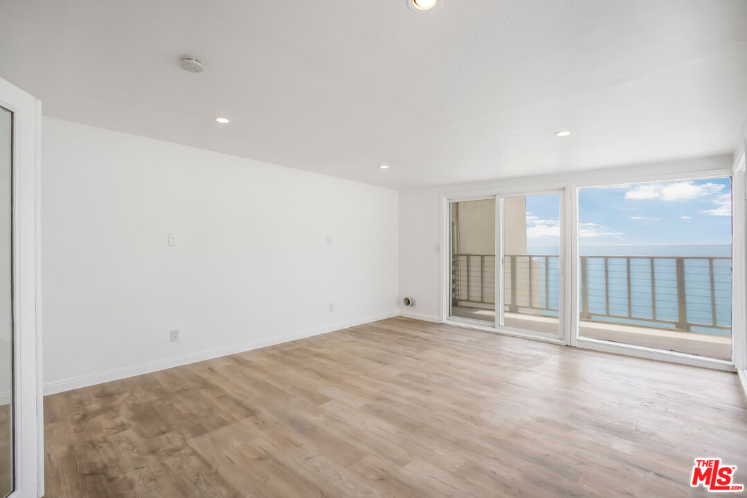 20644 Pacific Coast Highway Malibu, CA 90265 - Photo 8 of 32 a view of an empty room with wooden floor