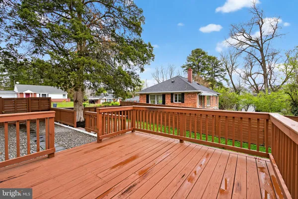 a view of a house with wooden deck