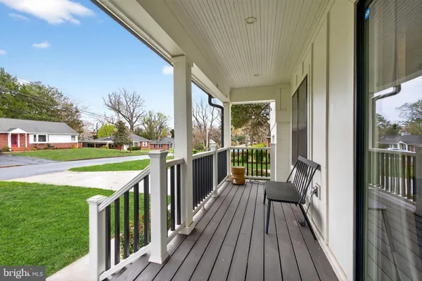 a view of a deck with wooden floor and outdoor space