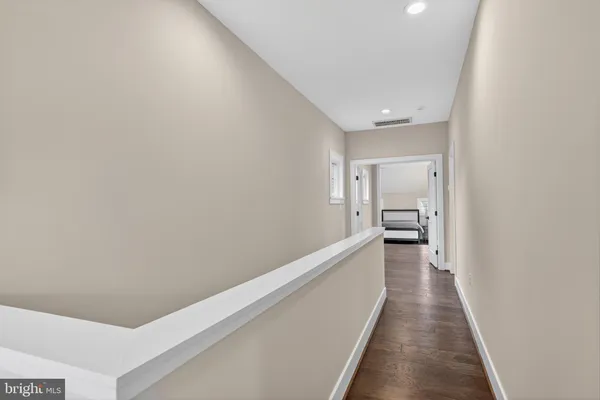 a hallway with a white walls