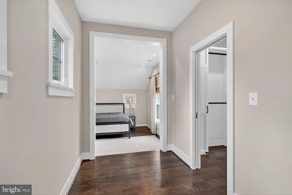a view of a hallway view with staircase