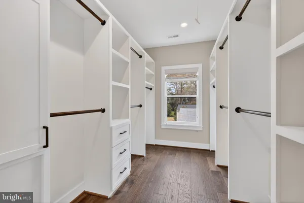 a view of an entryway with wooden floor