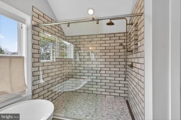 a bathroom with a shower toilet and sink